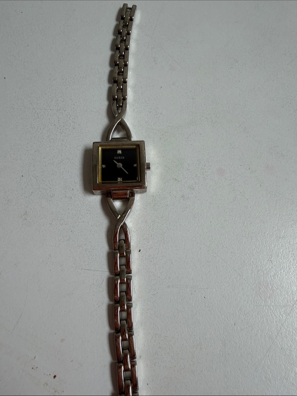 GUESS Silver-Tone Link Bracelet Watch with Black Dial and Gold Accents
